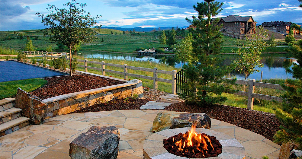 Outdoor-Hardscape-With-Stones-Landscaping-and-Fireplace